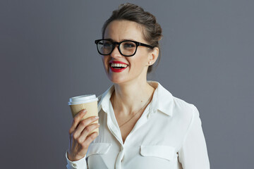 smiling modern female employee isolated on grey background