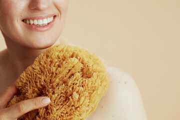 Closeup on woman with sea sponge