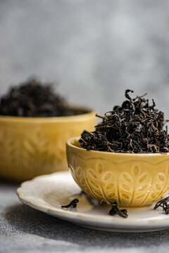 Close-up of two Ceramic bowls filled with loose leaf tea on a table