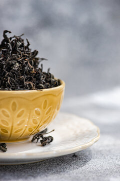 Close-up of a Ceramic bowl filled with loose leaf tea on a table