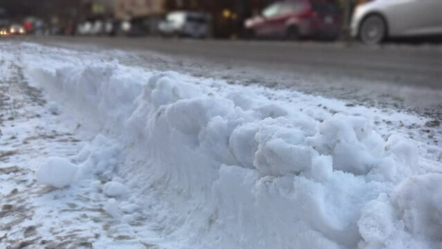 Snow pile pushed to edge of street 4k
