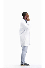 The doctor, in full height, on a white background, talking on the phone