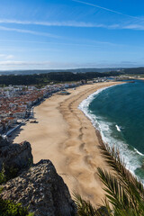 View from the hill to the sandy beach 'Praia da Nazaré' , Praia do Norte beach and Nazare town,...