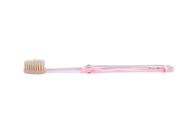 Pink toothbrush on white background