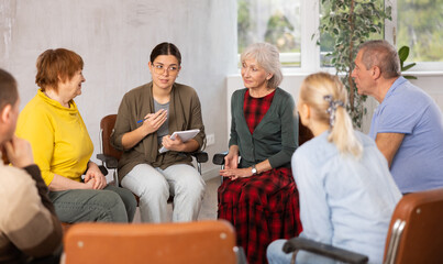 Young woman doing group training for seniors people