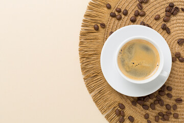 Cup of coffee on color background, top view