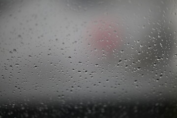 Water drops on fogged glass with a gray brightness gradient