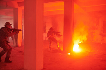  A group of professional soldiers bravely executes a dangerous rescue mission, surrounded by fire...