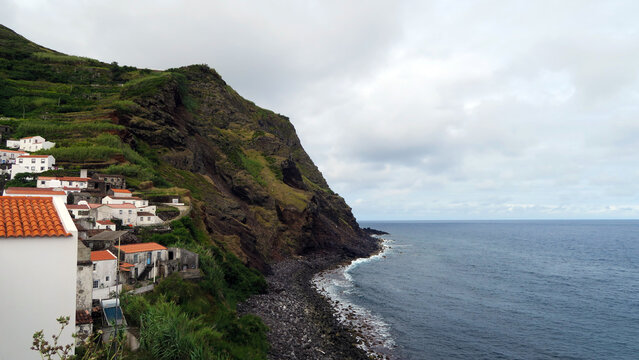 Corvo Island, Azores, Portugal. View of resident houses in the island's mountains close to the shoreline               