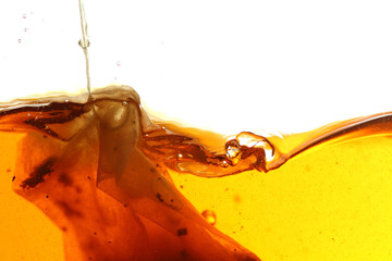 Close up shot of steeping tea bag in hot water