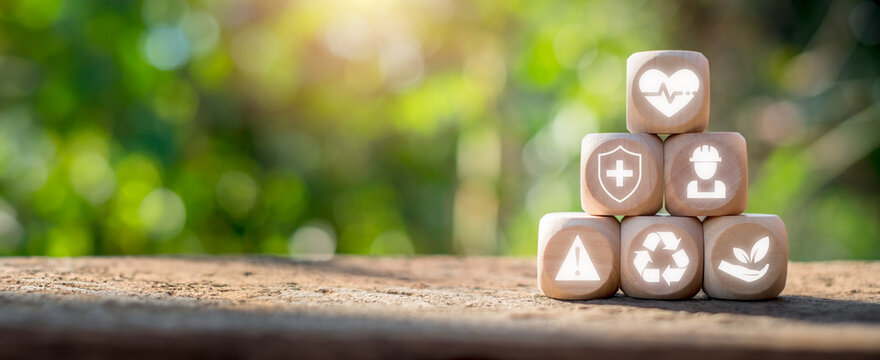 HSE, Health safety environment concept, Wooden block on desk with Health, safety and environment icon on virtual screen, Standard safe industrial work and industrial.