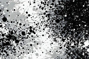 A black and white photo of a splatter of paint with many small dots