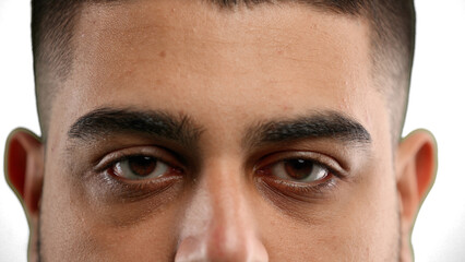 Obraz premium Man's eyes, close-up, on a white background