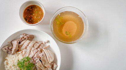 Hainanese Chicken Rice or Chicken Soup Rice - Asian Feet Style thaifood concept on
white background.  