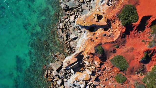Red Dirt Cliffs Meet Turquoise Blue Ocean Rocky Kimberley Broome Western Australia Outback Aerial Footage