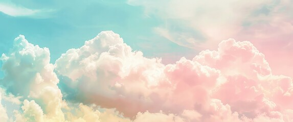 Light fluffy clouds against a blue sky background.