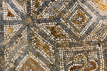 Antique mosaic on floor, destroyed buildings. Detail of geometric mosaic. Ephesus. Turkey