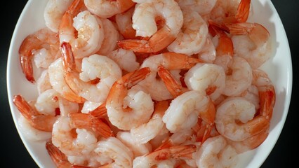 Frozen shrimp: convenient, delicious seafood option for year-round enjoyment. Proper handling, cooking yield flavorful, satisfying meals for seafood lovers. Food concept. Shrimp background. 

