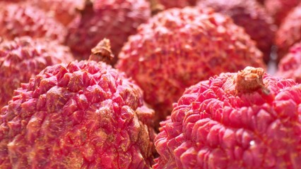 Captured up close, lychees command attention with their fiery red skins, adorned with spiky armor....
