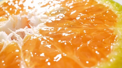 Revel in the vivid allure of a freshly halved orange, its lush, succulent flesh bursts with vibrant...