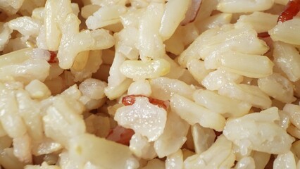 Behold the delicate allure of cooked Jasmine brown rice, each grain tender and distinct. Its fluffy...