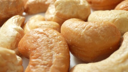 Savor the allure of roasted cashew nuts, boasting an even roast and a golden-brown complexion....