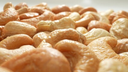 Savor the allure of roasted cashew nuts, boasting an even roast and a golden-brown complexion....