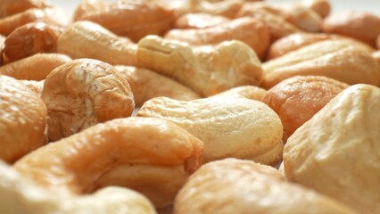 Savor the sight of roasted cashews, their luscious golden-brown hue beckoning. With a tantalizingly rough texture, these crunchy delights are the epitome of a nutritious snack.
