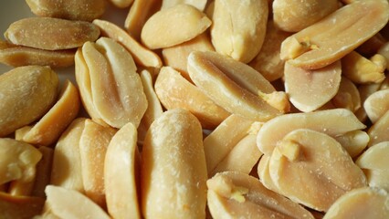 Revel in the crisp texture of roasted peanuts, their golden-brown hue promising a savory delight....