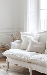 White French style sofa in a white room, interior design in the French country style, white furniture, white pillows and cushions, close up shot