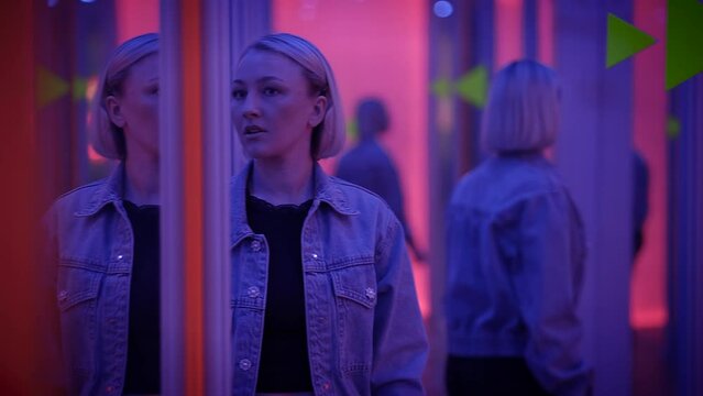 Confident Female Person Moving Inside Hall of Mirrors Seeing Self Reflection