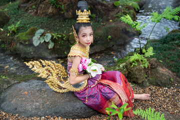 Cute girl in Kinnaree dress. The Kinnaree is significant character in Thai literature, a...