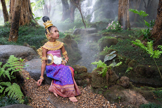 Cute girl in Kinnaree dress. The Kinnaree is significant character in Thai literature, a half-human, half-bird creature, a beautiful woman with wings to fly, resides in the Himavanta forest