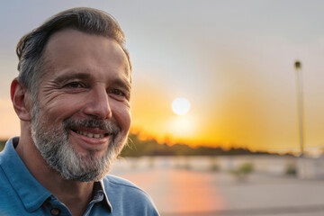 Fototapeta premium portrait of a mature man, man smiling, looking at the camera