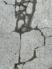 a photography of a shadow of a person on a sidewalk.