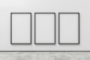 Three empty frames on a blank wall