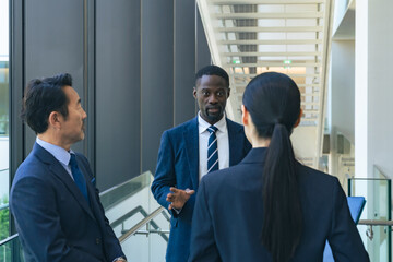 Group of multinational business people having a conversation in a lobby