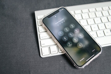 Lockscreen Smartphone Display On Keyboard Over Grey Background. Smartphone Security