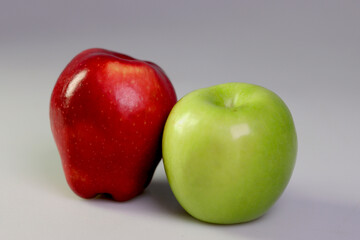 
juicy red and green apple with white background