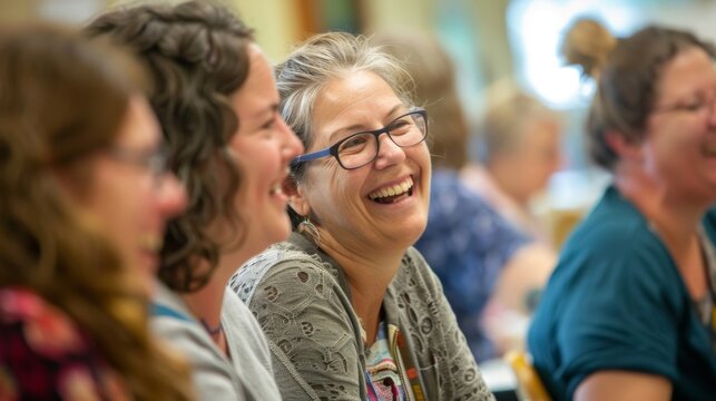 A lively atmosphere filled with laughter and conversation as workshop participants share their progress and techniques with one another.
