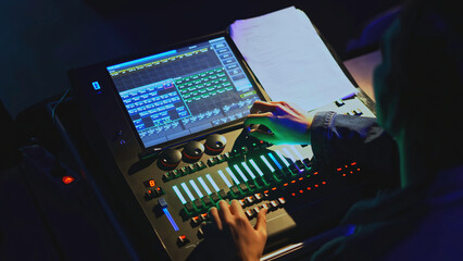 Audio equipment mixing. Media. Sound engineer and light engineer control modern console. Control of...