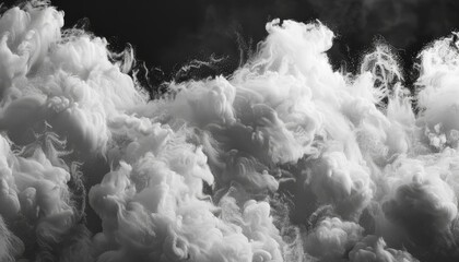 Close up of white cotton wool cloud on black background perfect for design and template