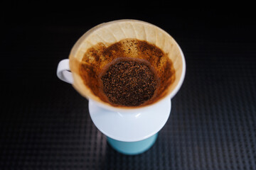 Freshly Brewed Pour Over Coffee beans, plastic Hario V60, Grounds cone Filter, black background, caffeine, beverage