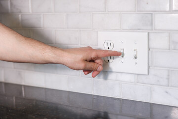 Turning Off Light Switch to Save Electricity Energy