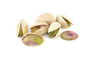 Randomly spread pistachios isolated on white