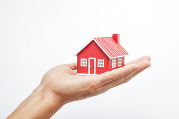 Red House Model Held in Open Hands