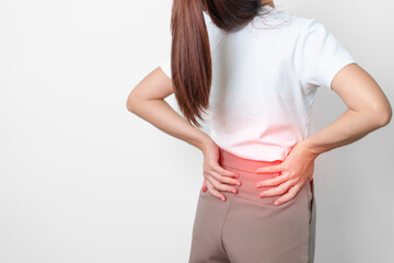 adult female with muscle pain on gray background. Elderly woman having back body ache due to...