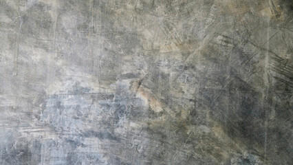 Smooth concrete or cement wall background with scratches and stains, grey-black gradient. For...