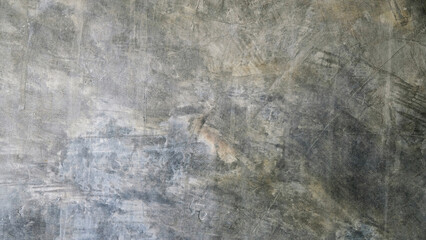 Smooth concrete or cement wall background with scratches and stains, grey-black gradient. For backdrops, decorations, scenes