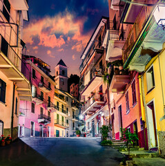 Second city of the Cique Terre sequence of hill cities - Manarola. Colorful spring night in...